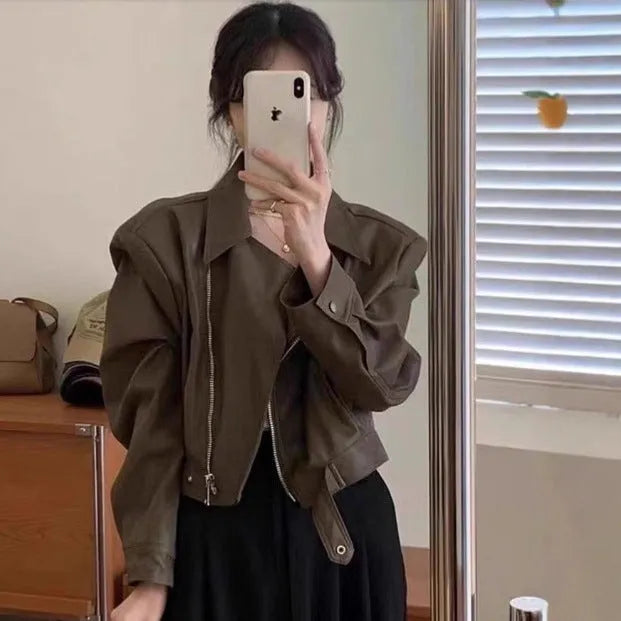 Women's slim fit leather coat jacket in black with long sleeves and pockets