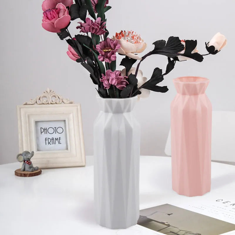 Green melamine plastic vase with a wide 7.2cm base on a wooden table.
