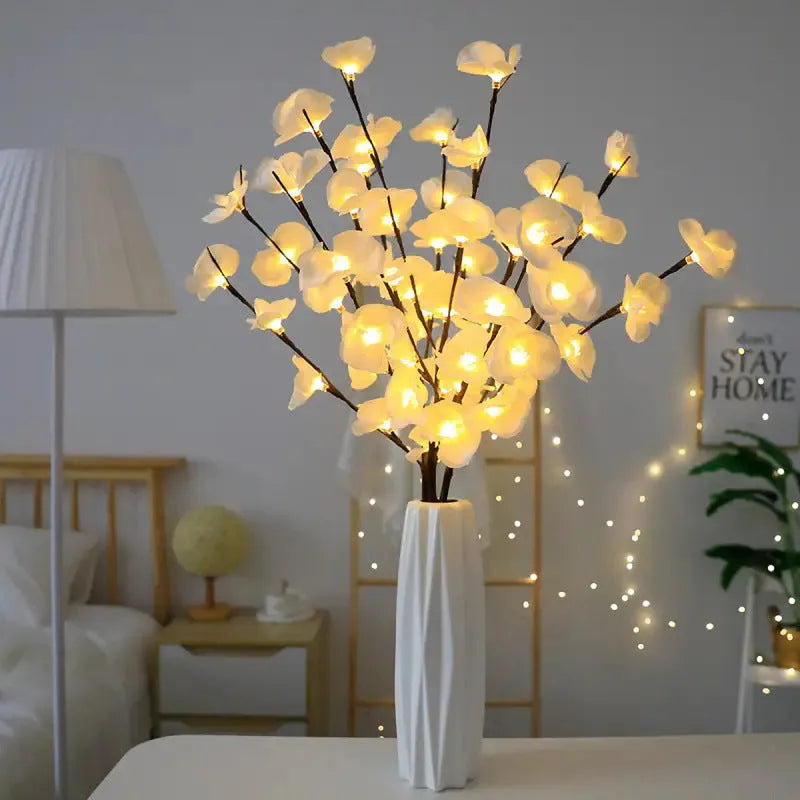 Pink LED phalaenopsis orchid branch decorative light with warm white LEDs on a 65cm stem.