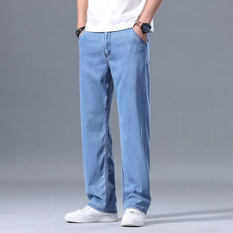 Men's loose fit straight-leg jeans in Lyocell fabric, shown in light blue colour