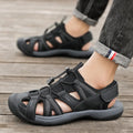 Men's blue casual sports shoe with Velcro straps and a breathable mesh upper on a rubber sole.