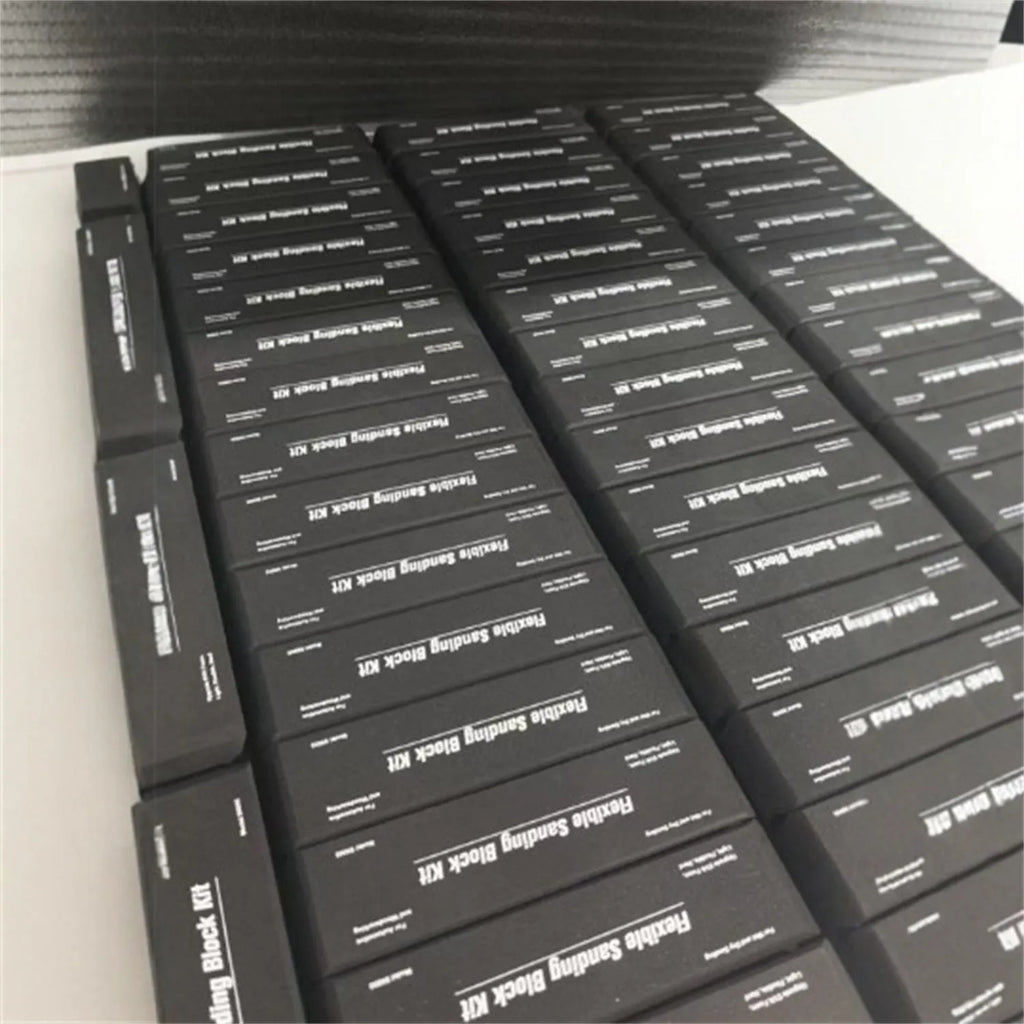Seven black frosted EVA display blocks arranged in staggered formation