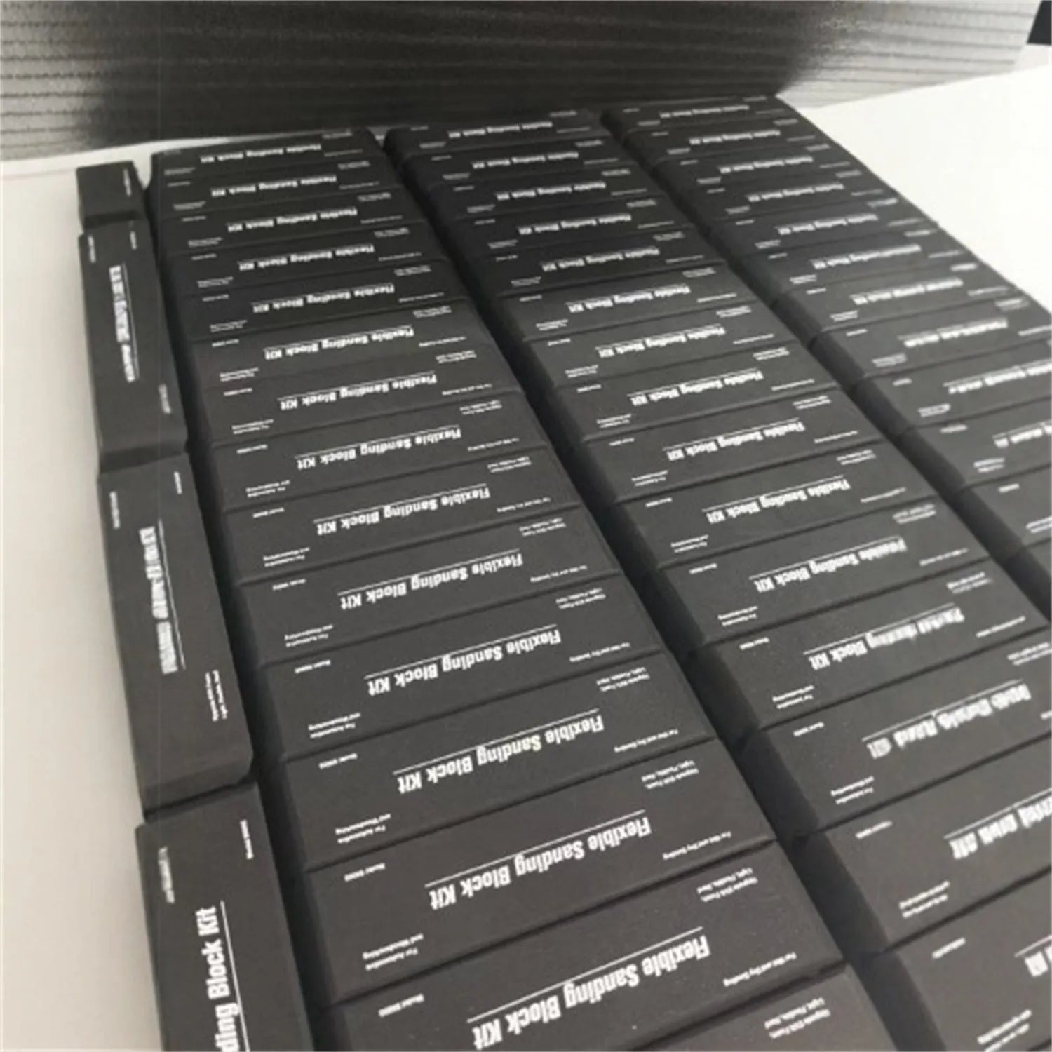 Seven black frosted EVA display blocks arranged in staggered formation