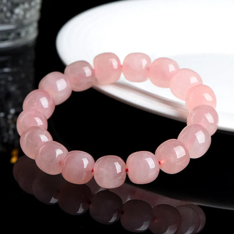 Natural pink crystal barrel bead bracelet with geometric 8x10mm beads