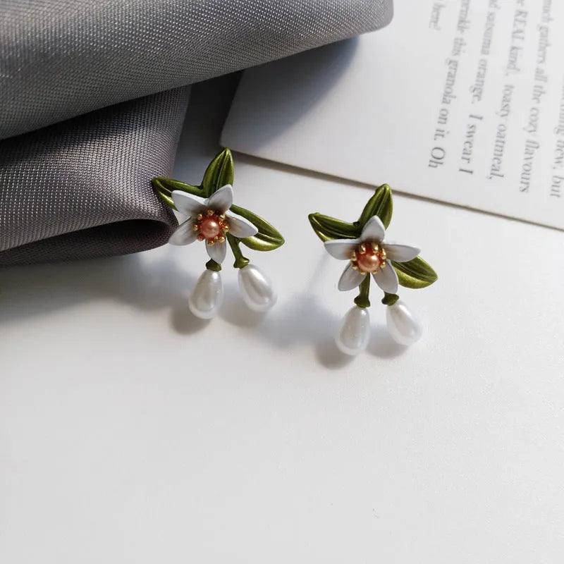 Alloy needle camellia flower earrings for women in sterling silver and coloured variations