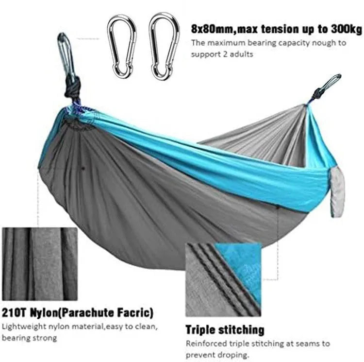 Blue nylon parachute cloth camping hammock hung between trees, showing its 270cm length.
