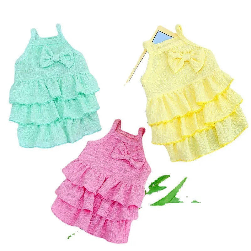 Small dog wearing polyester princess dress with layered candy skirt in rose red colour