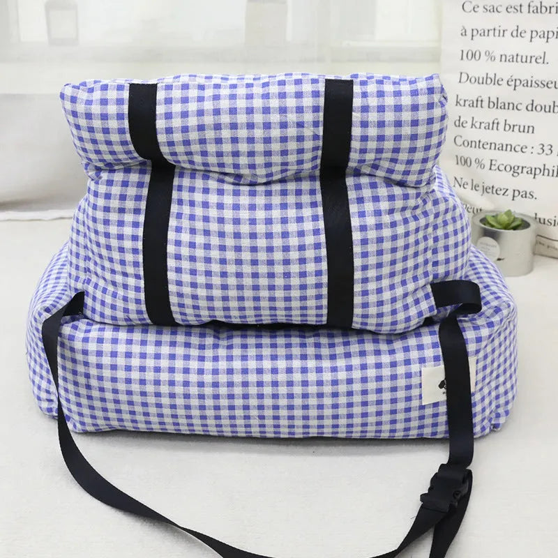 Car-mounted pet carrier nest in blue plaid cloth for dog transport