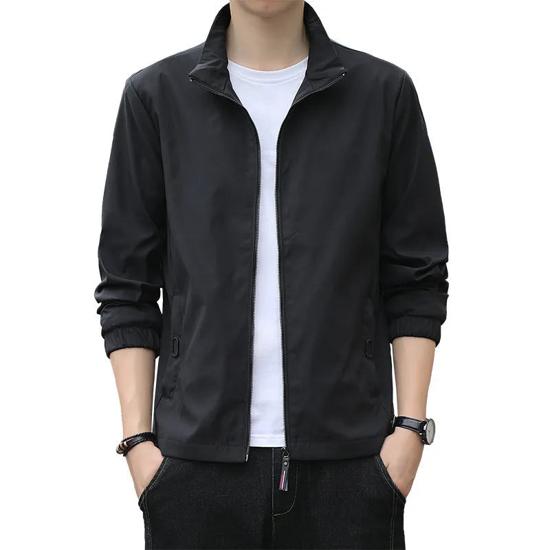 Man wearing black loose-fit Korean style autumn jacket with zip pockets