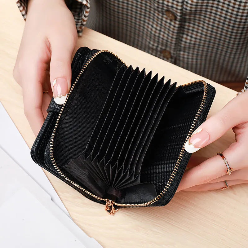 Ladies short PU wallet with lychee pattern in beige, pink, black, or red colour.
