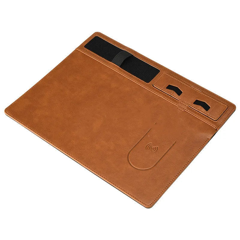 Pink wireless charging mouse pad with phone holder on a desk, dimensions 320mm by 260mm.