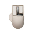 Xiaoqiao tofu-colour wireless mouse showing seven buttons and scroll wheel on desktop