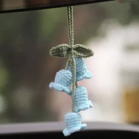 Knitted green and white car plant decoration with hanging rope