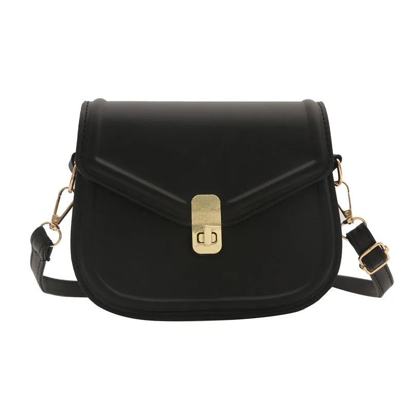 Soft PU messenger bag with textured finish and clamshell opening in horizontal square shape