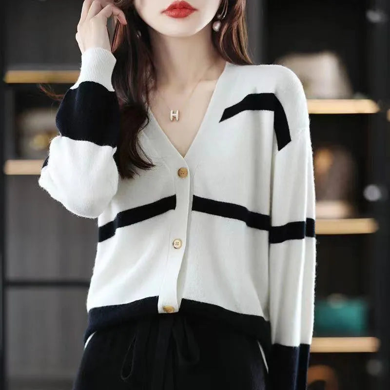 Women's slim fit striped cardigan with 3D pattern texture, V-neck, and button front closure.