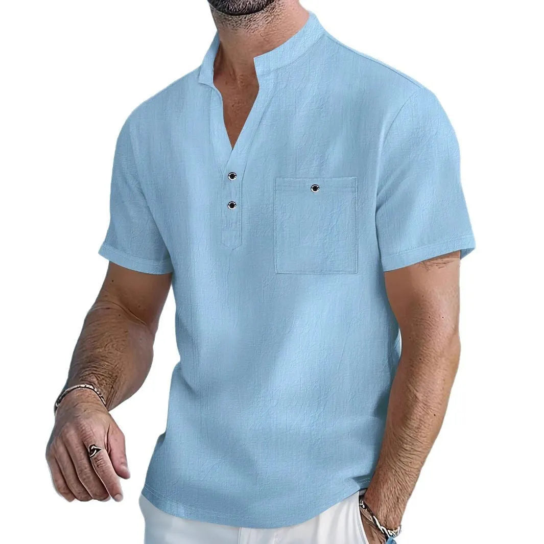 Man wearing a light apricot-coloured linen stand collar T-shirt with short sleeves and a loose fit.
