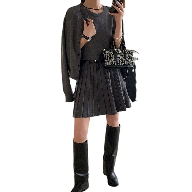 Women's grey Art Retro knitted vest skirt and long-sleeved cardigan two-piece set with pleated detail.