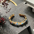 Adjustable copper ring with gourd motif, flower and bow shapes, zircon stones in six colour options