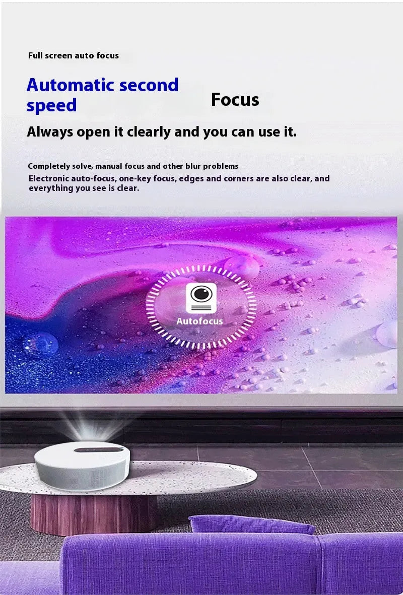 White HD home projector with remote control on a table.