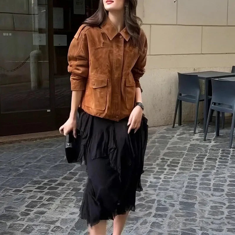 Women's bright brown suede coat with regular sleeves on a hanger