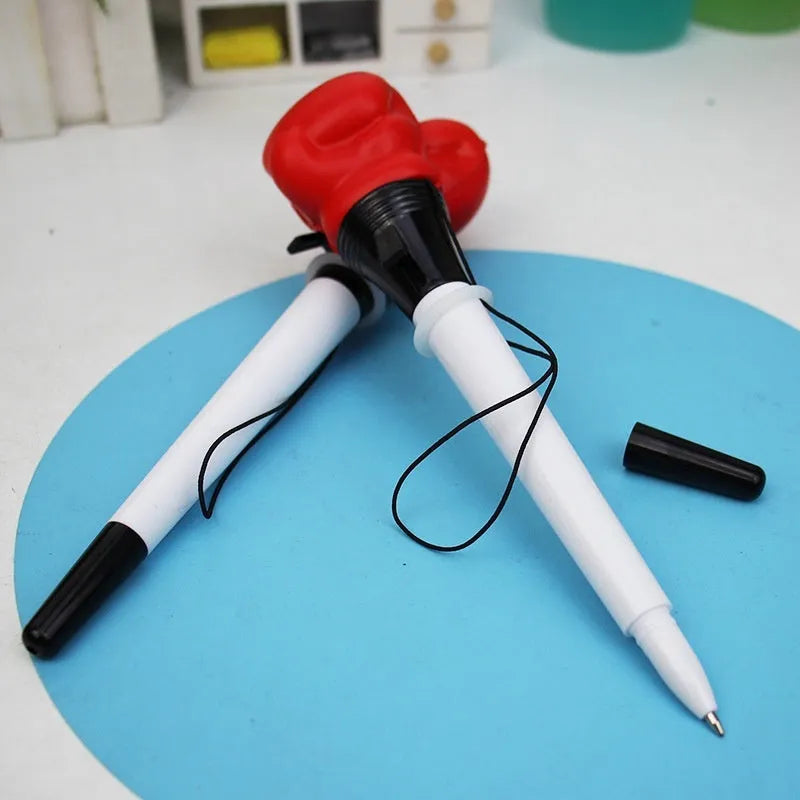 Set of four black and silver boxing press ejection pens with 0.7mm bullet tips displayed on a white surface.