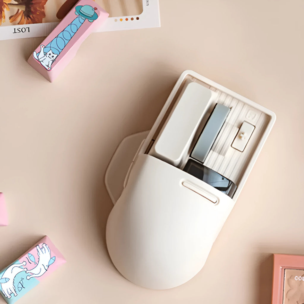 Xiaoqiao tofu-colour wireless mouse showing seven buttons and scroll wheel on desktop