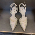 Women's black hollow cut stiletto high heels with pointed toe and red sole on a white background