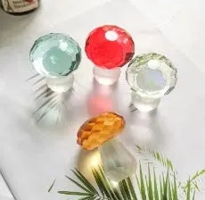 Colourful mushroom crystal decorative craft in transparent, green, red and yellow hues measuring 40x53mm
