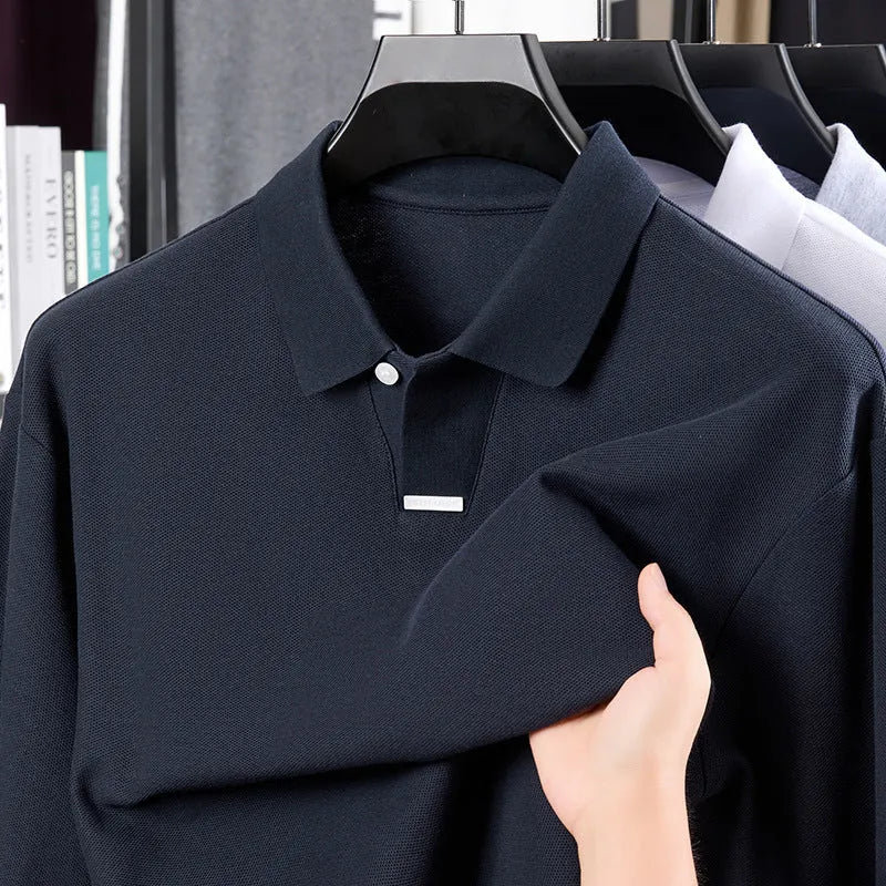 Men's loose fit cotton polo shirt in black with lapel collar and long sleeves on a hanger
