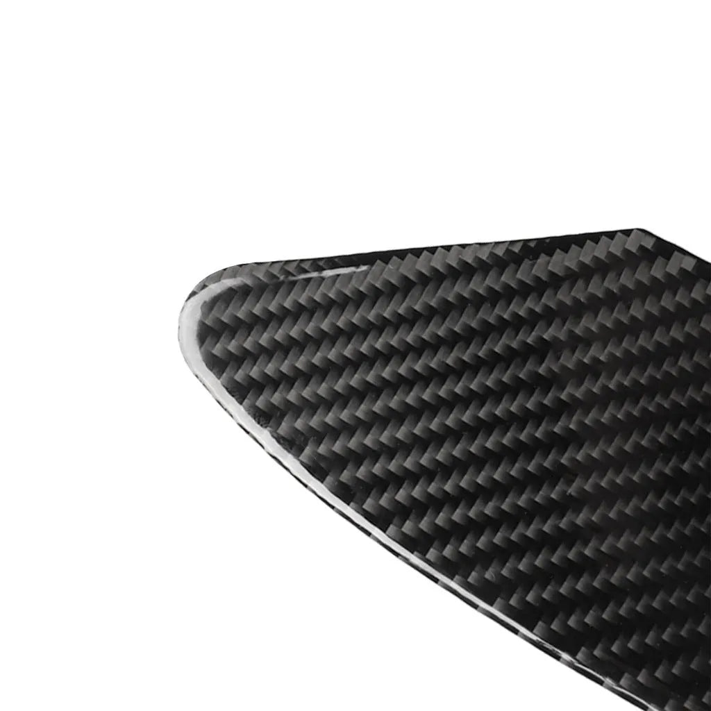 Carbon fibre textured sticker for covering a device charging port panel, showing the 3M adhesive backing.