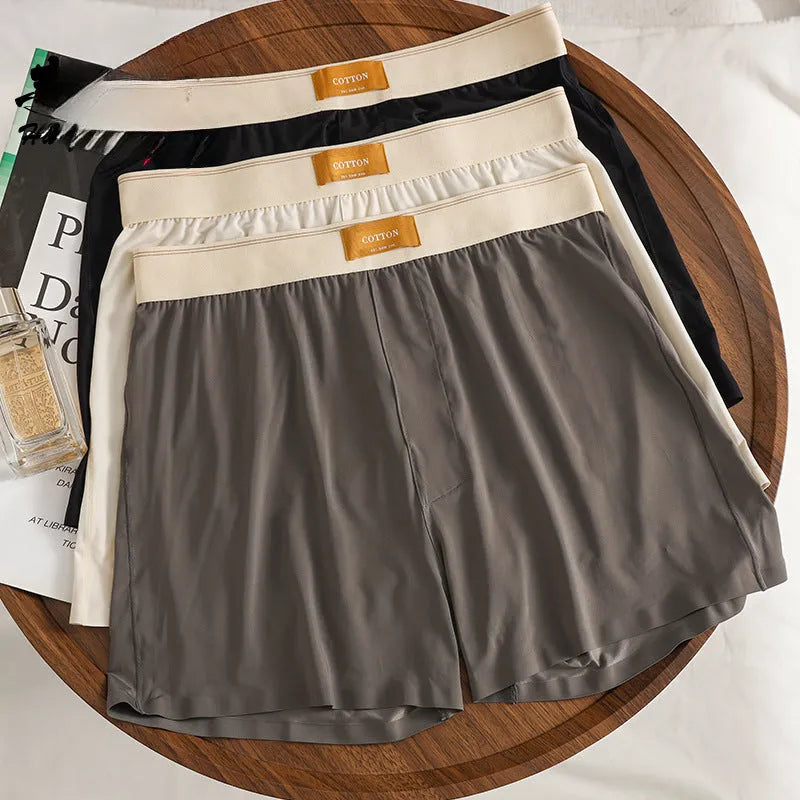 Men's loose fit ice silk underwear in solid colours on mannequin showing mid waist style