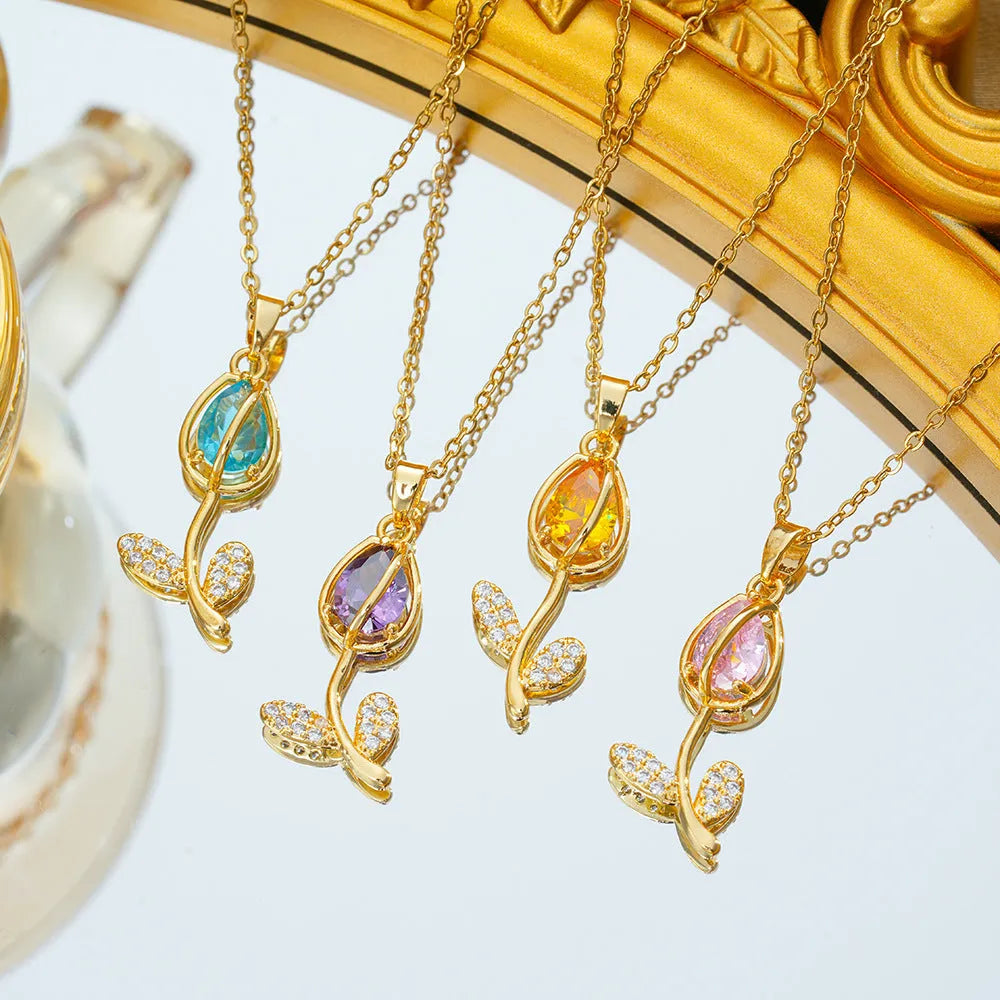 Zircon tulip necklace for women in gold tone with flower pendant on adjustable O-ring chain.