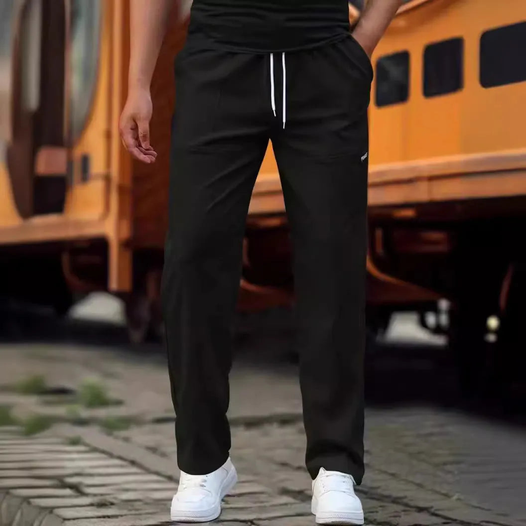 Men's polyester trousers for spring and autumn in light grey, shown in size M.