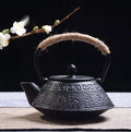 Japanese-style cast iron teapot with decorative enamel finish and 0.9-litre capacity