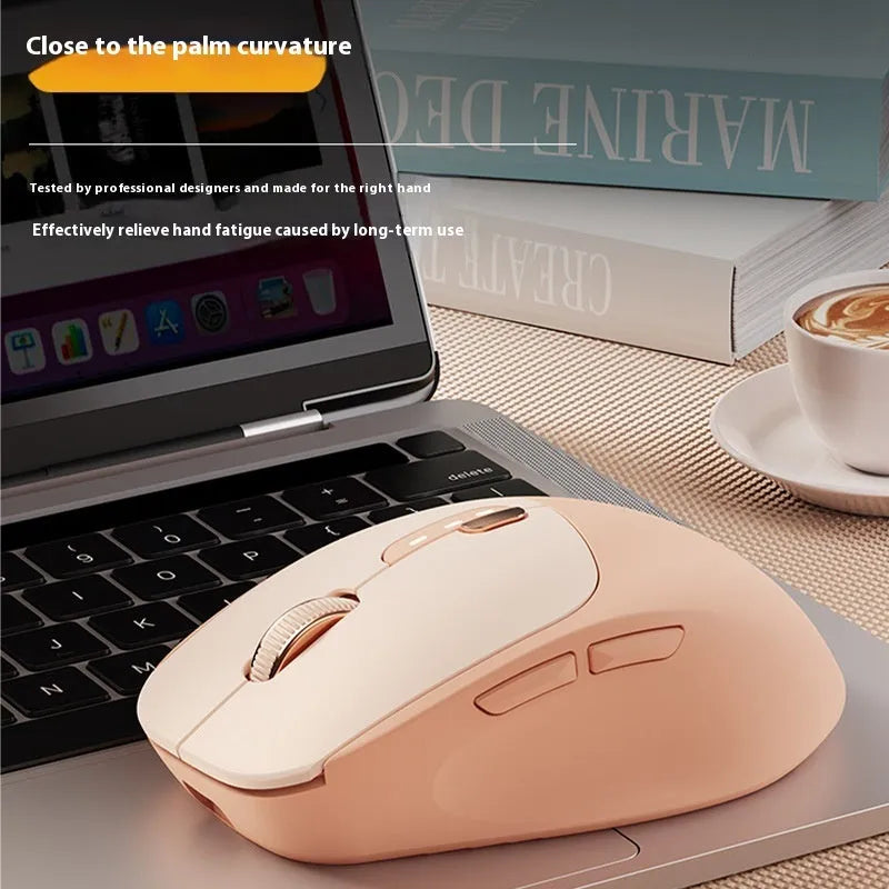 Mute wireless Bluetooth computer mouse in Matcha Green colour on a desk