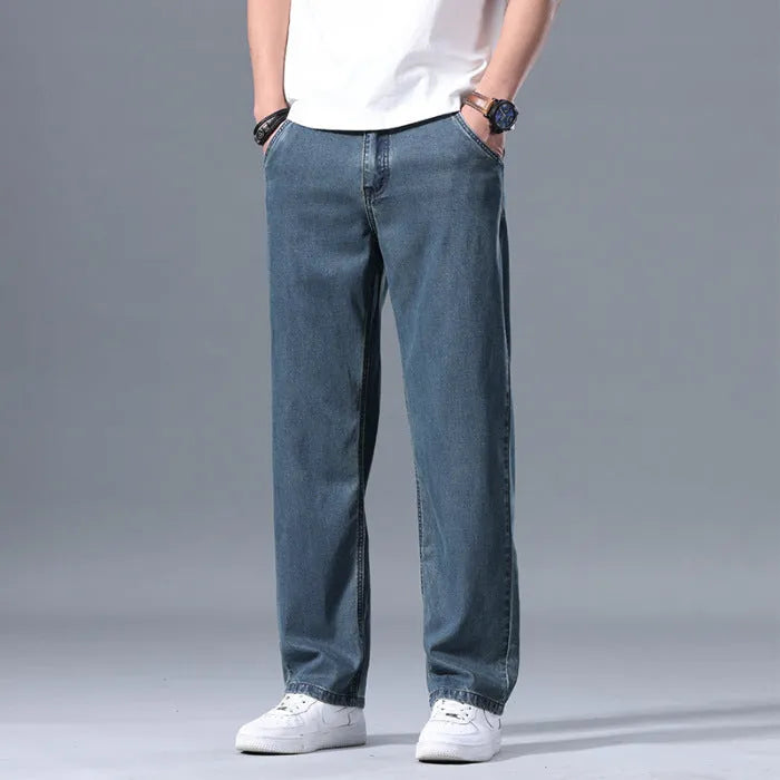 Men's loose fit straight-leg jeans in Lyocell fabric, shown in light blue colour