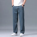 Men's loose fit straight-leg jeans in Lyocell fabric, shown in light blue colour