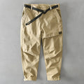Men's khaki cotton casual overalls with elastic waistband and loose leg fit.