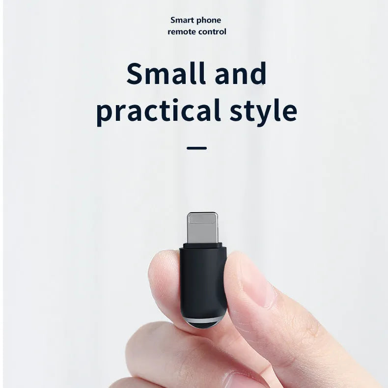 Black capsule-shaped infrared emitter with Lightning, Type-C and Micro-USB interfaces, shown next to a ruler for scale.
