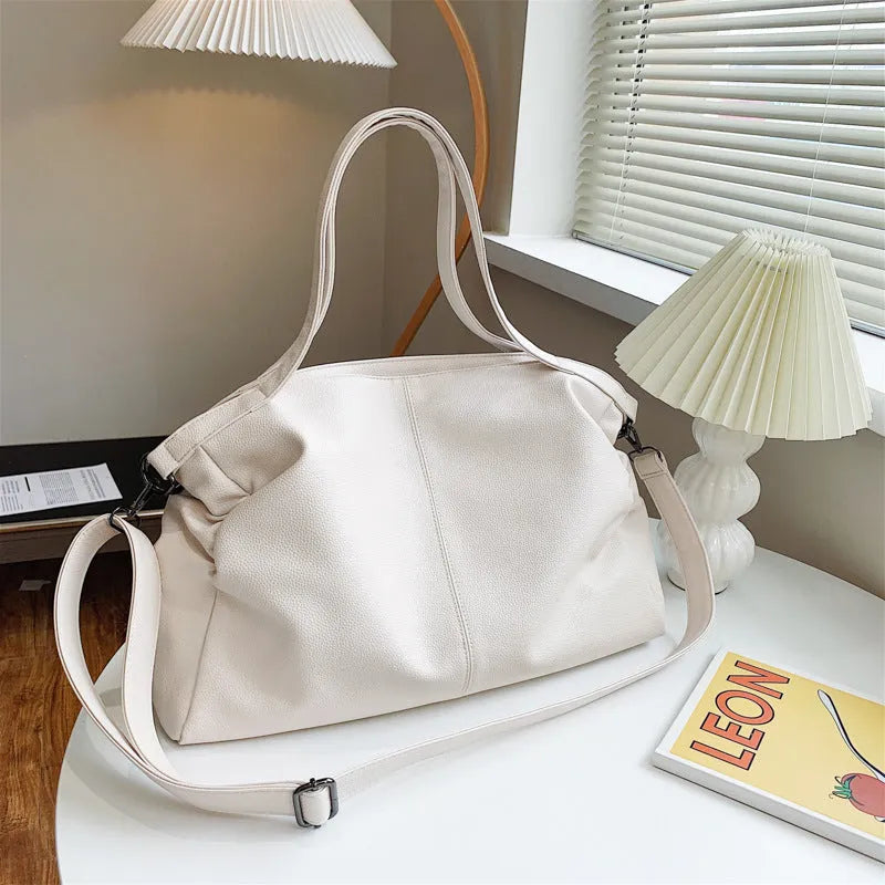 Large soft black PU leather messenger bag with adjustable shoulder strap and front zip.