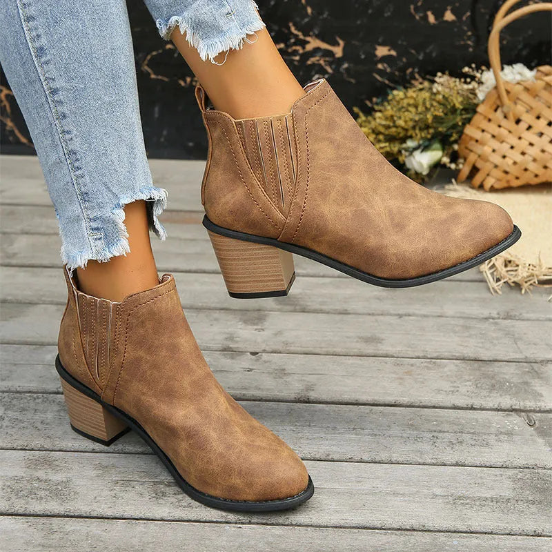 Women's black ankle boots with pointed toe and thick square heel, slip-on design for autumn winter wear