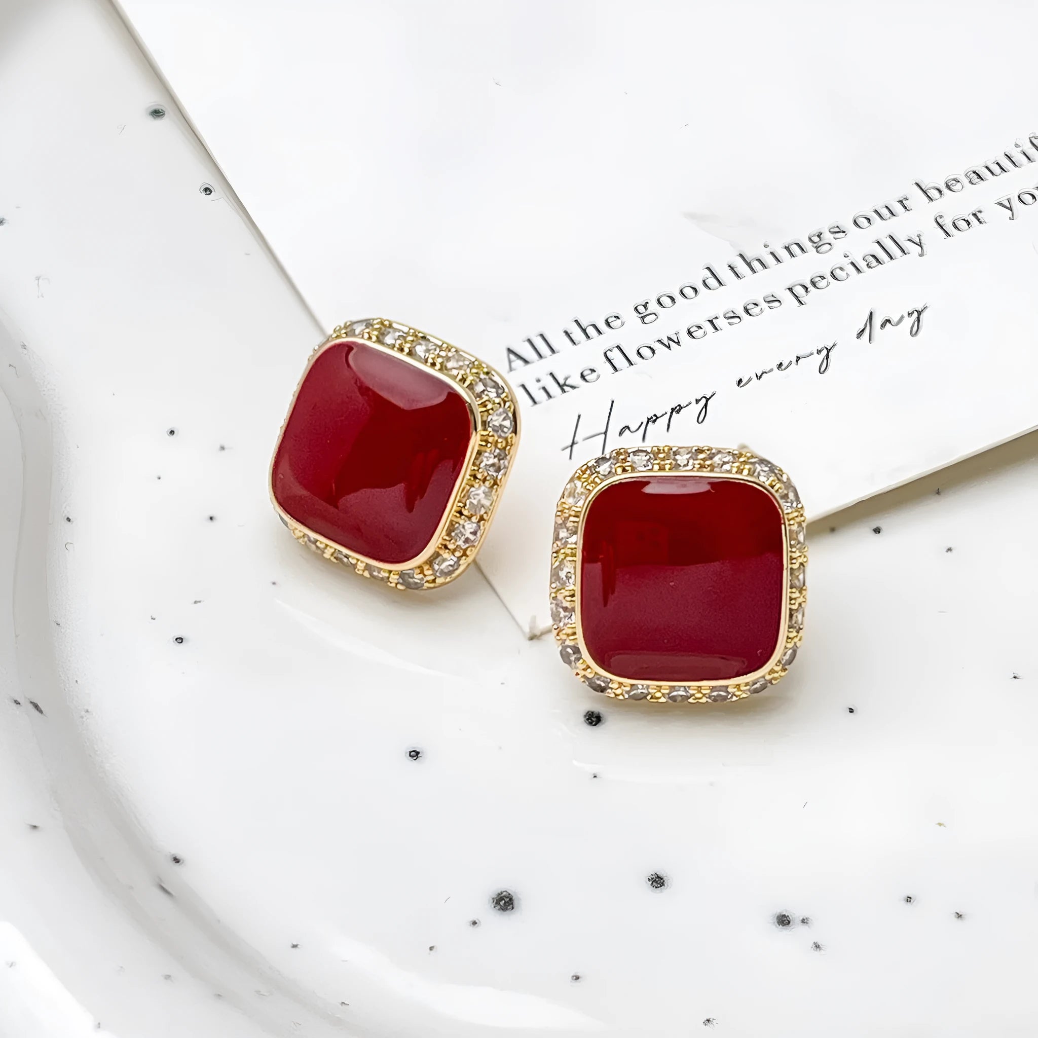 Red geometric square earrings with inlaid design details on alloy material