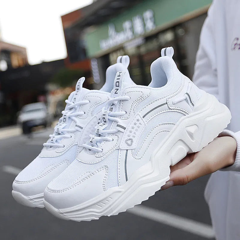 Women's white thick-soled casual sports shoes with mesh upper and buckle detail in Moonlight colour.