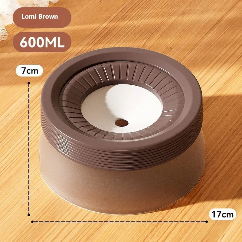 Green non-wet mouth suspension pet water bowl for dogs and cats on a white plate