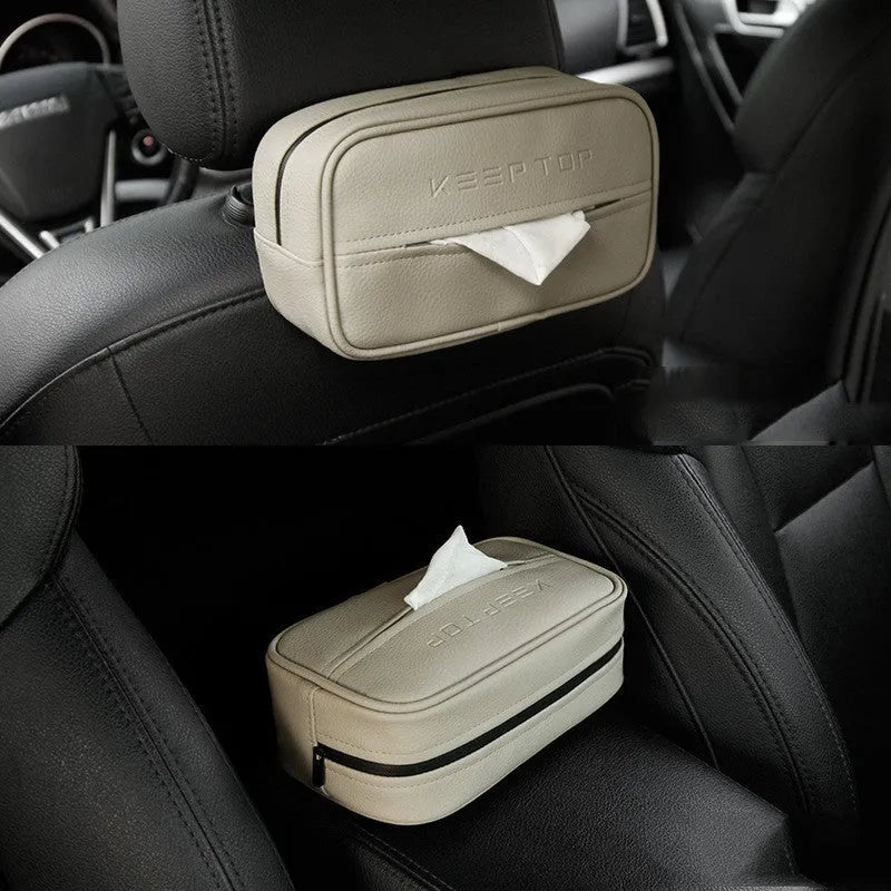Black leather storage box with removable paper bag inside for car and home organisation.