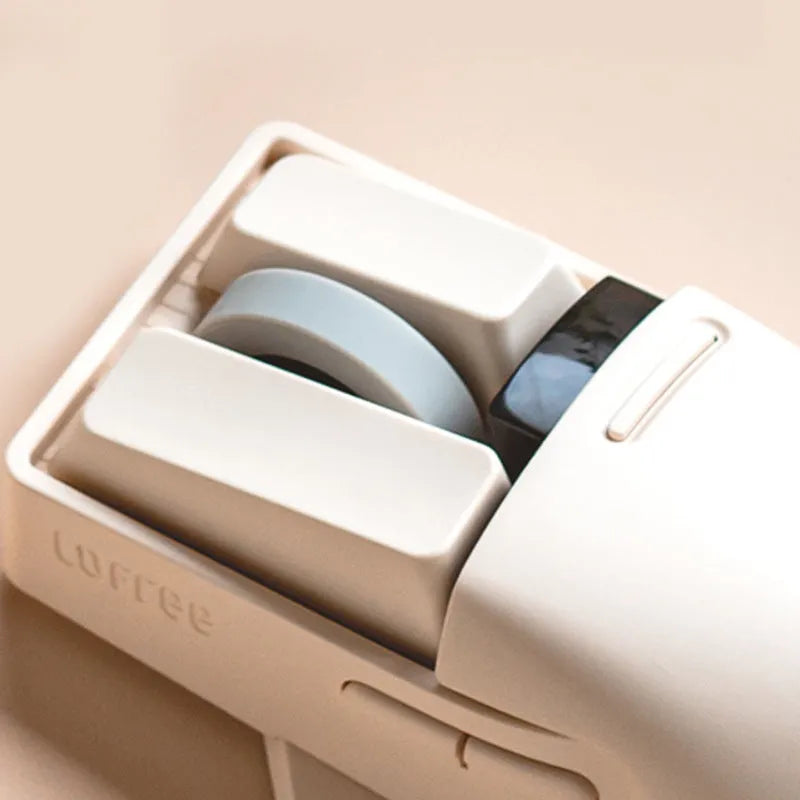 Xiaoqiao tofu-colour wireless mouse showing seven buttons and scroll wheel on desktop