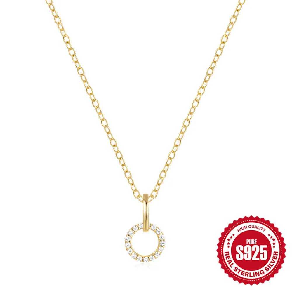 Gold colour S925 sterling silver clavicle chain necklace with a round zircon pendant on an adjustable chain.
