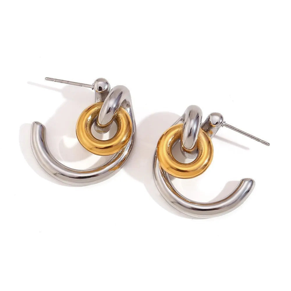 Gold electroplated stainless steel jewellery set comprising geometric earrings, bracelet and necklace.