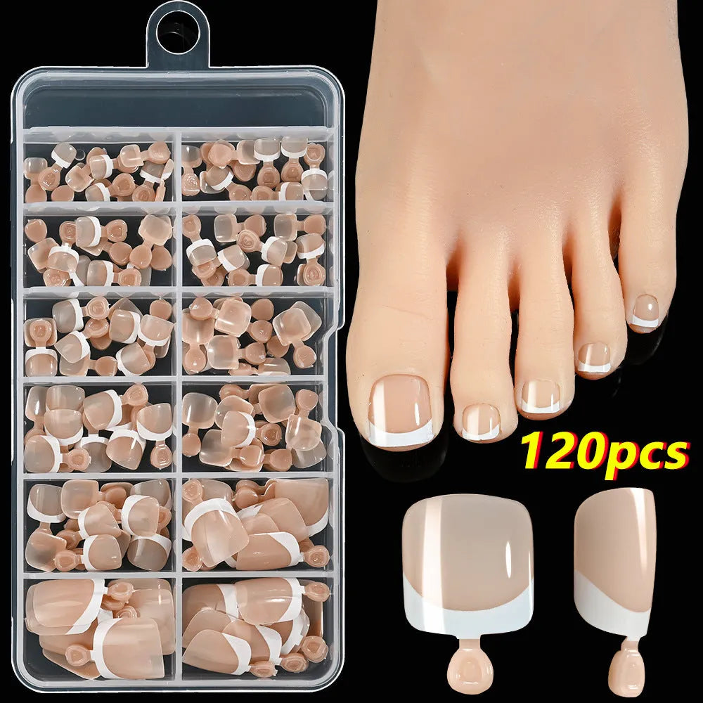Open box showing 120 French style toe nail pieces with white tips in various nude colours.