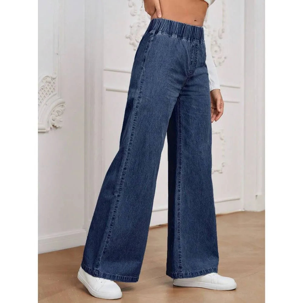 Plus size light blue washed wide-leg denim jeans on a hanger, showing straight leg cut.